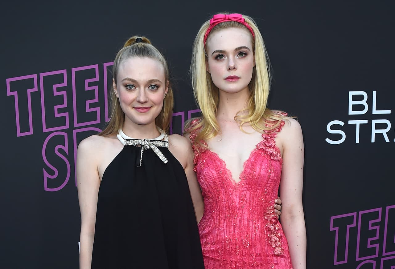Dakota Fanning, left, and Elle Fanning arrive at a special screening of "Teen Spirit" at ArcLight Hollywood on Tuesday, April 2, 2019, in Los Angeles. (Photo by Jordan Strauss/Invision/AP)
