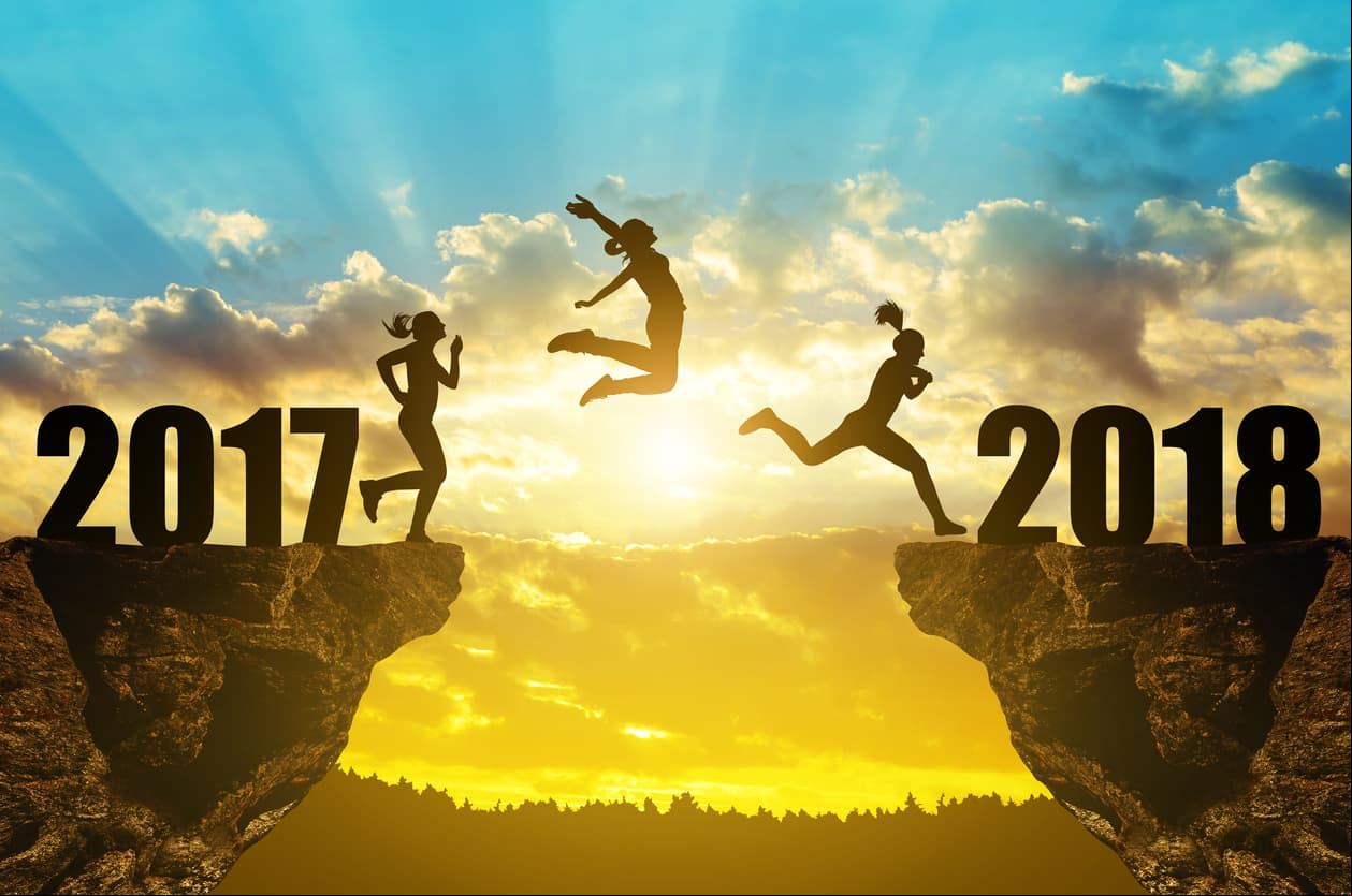 Girls jump to the New Year 2018 at sunset.